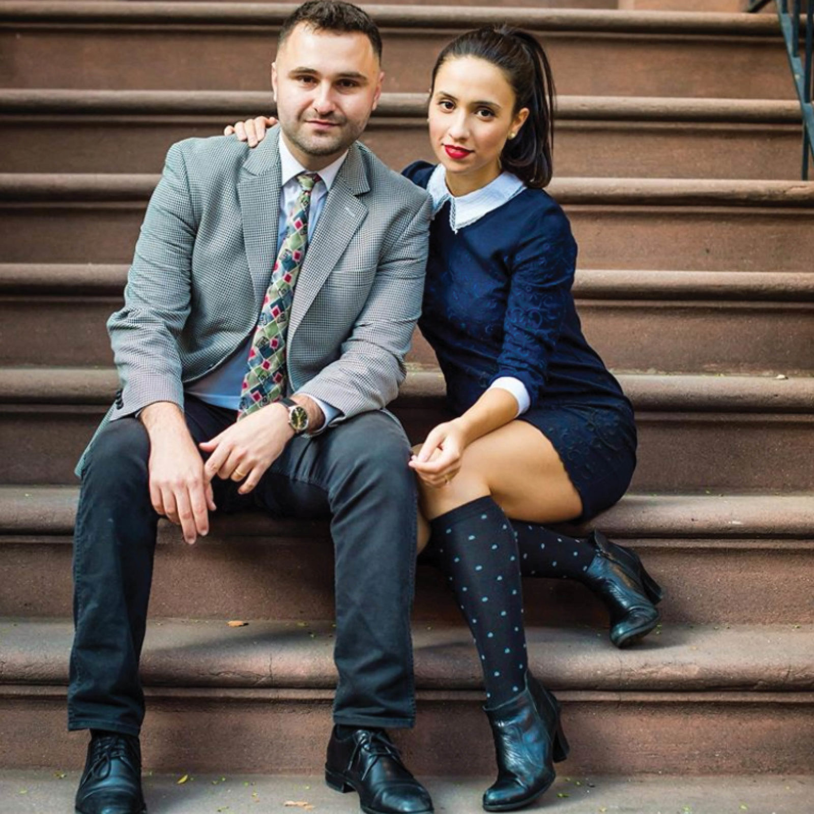 Photo of Vanessa Perea and Robert Edwards sitting on steps