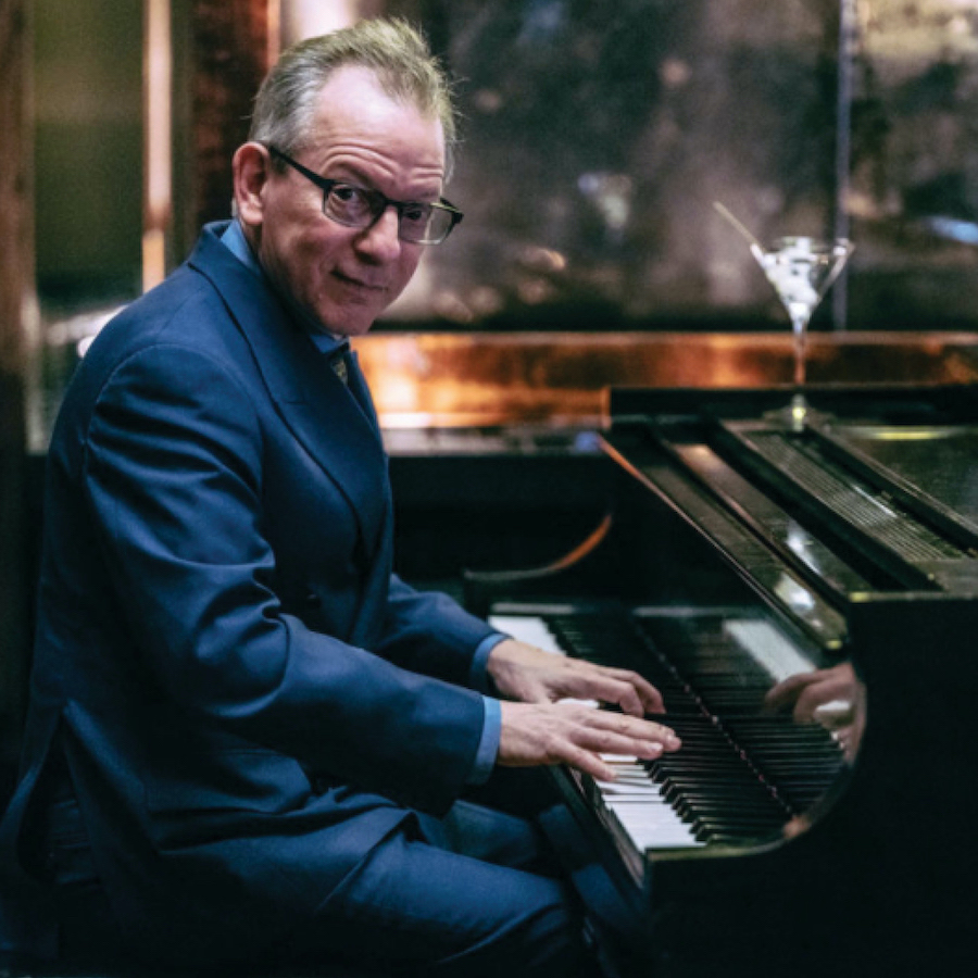 Musician Michael Garin at the piano playing live music in downtown NYC at Roxy Bar.