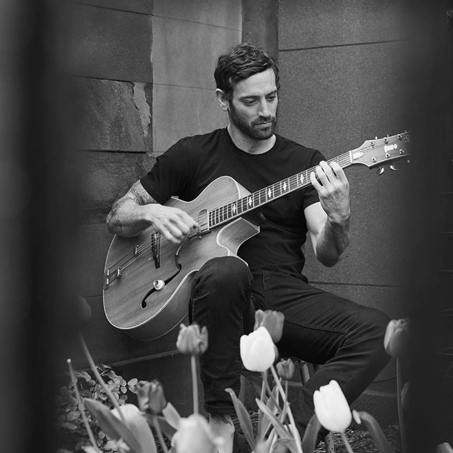a picture of a guitarist Matthew Avedon for his LIVE performance at Roxy Bar