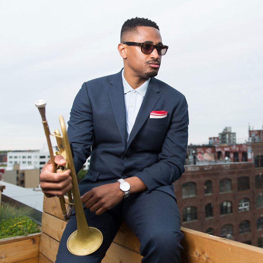 Headshot of Bruce Harris holding his trumpet