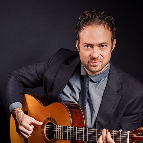 Q Morrow playing the guitar
