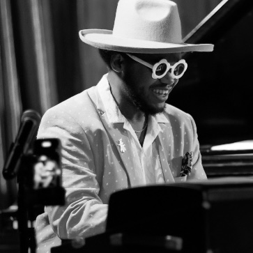 Musician William Hill III playing piano.