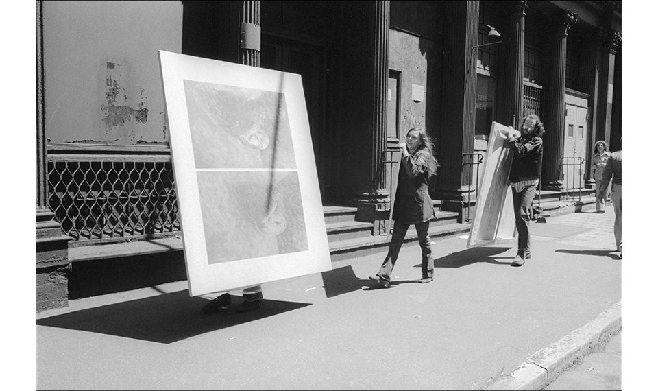 Soho artists carry paintings