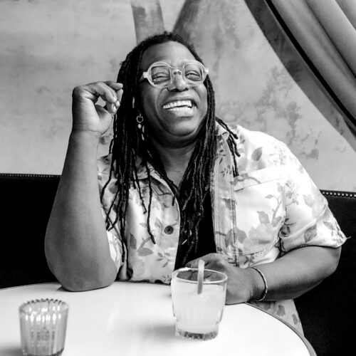 Darnell white sitting with cocktail 500x500