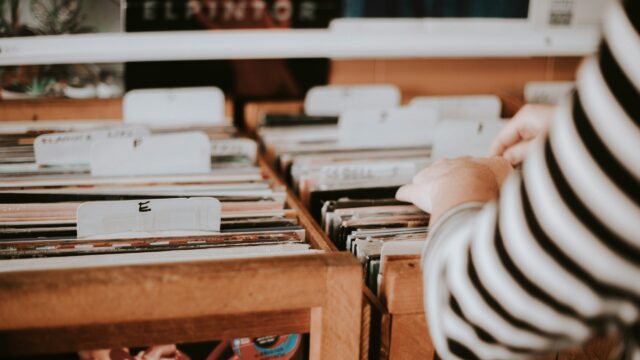 A person searches through records in a record store