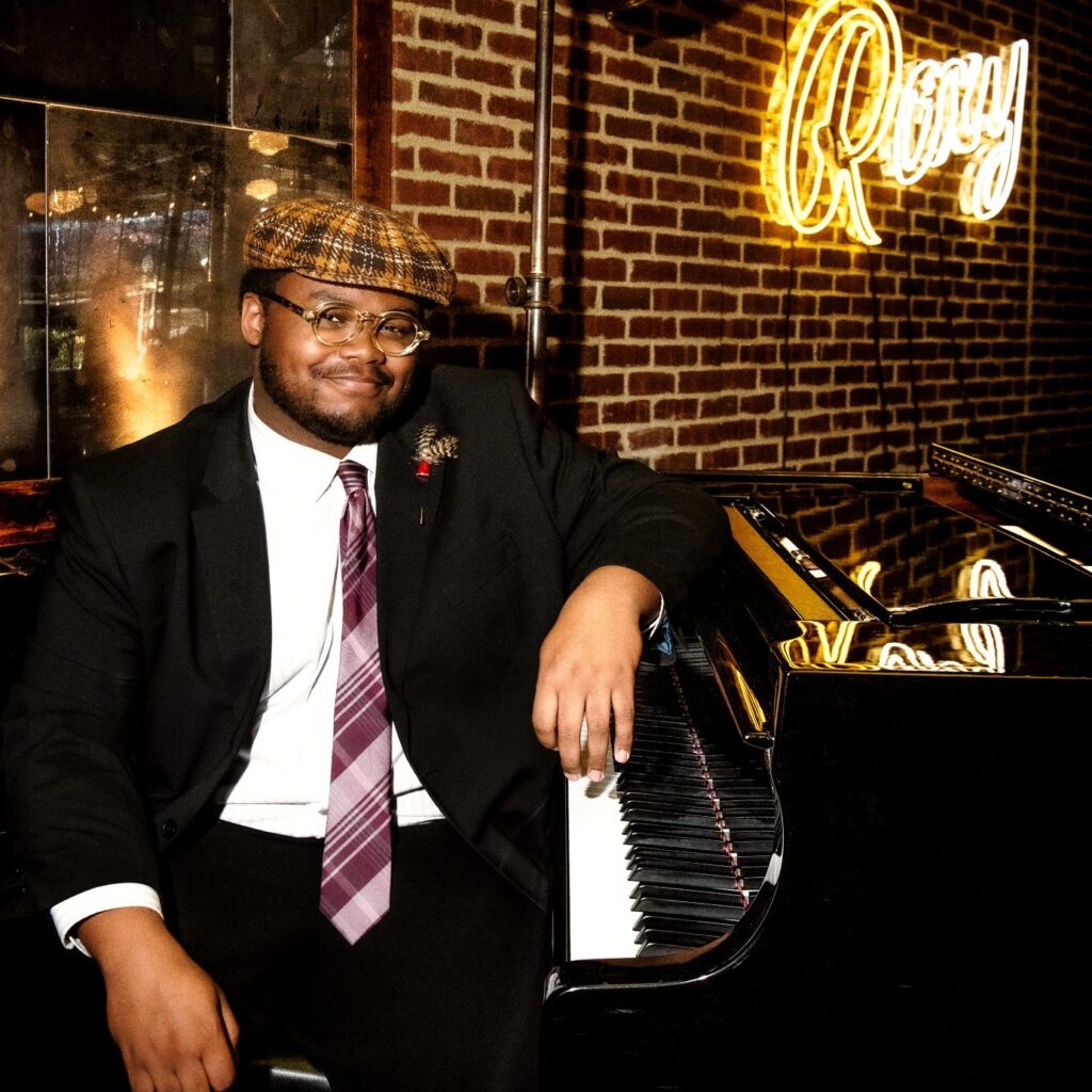 William Hill III sitting at the piano onstage at Roxy Bar in Roxy Hotel.