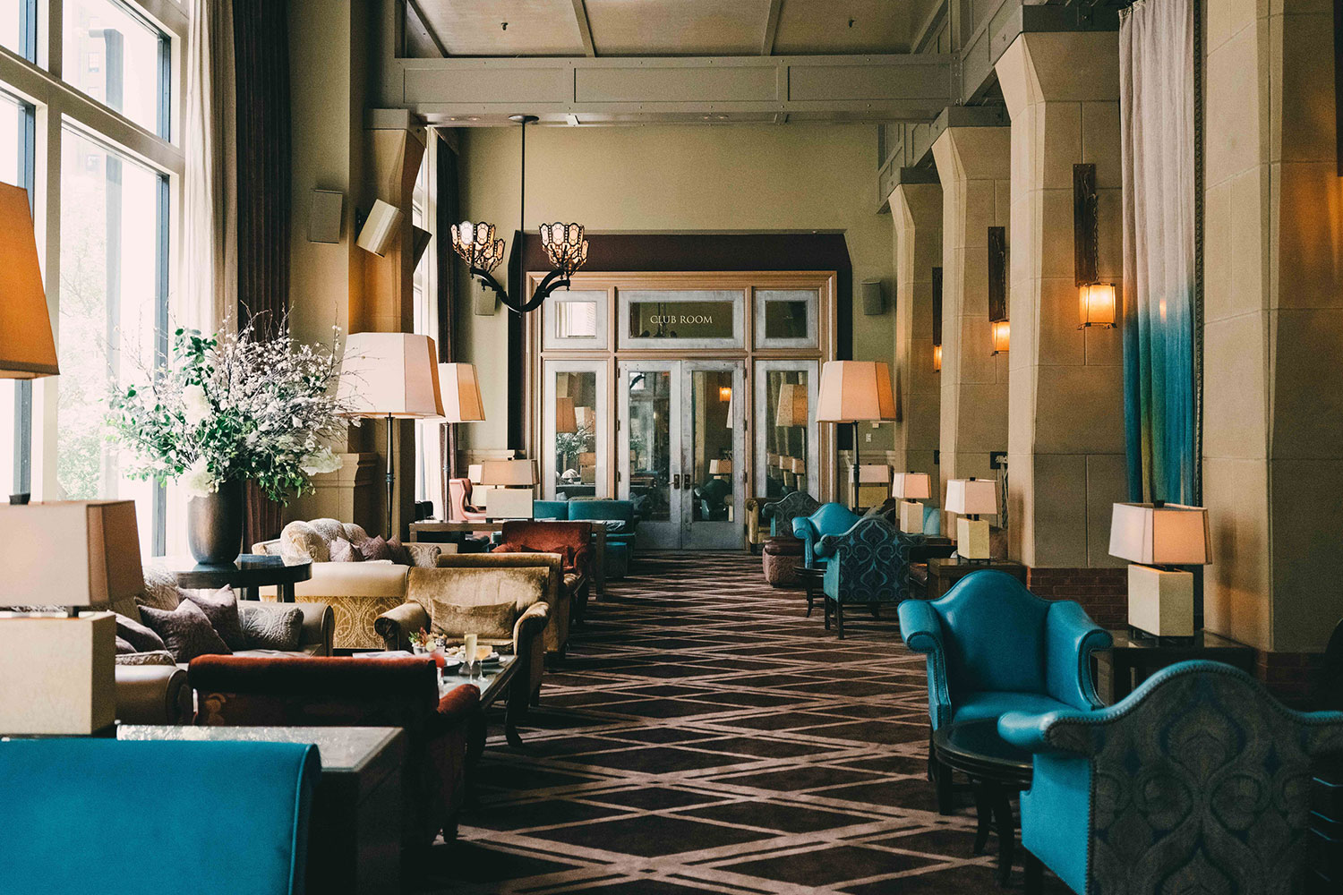 Interior shot of the Salon at the Soho Grand. There are multiple couch set ups for social gatherings