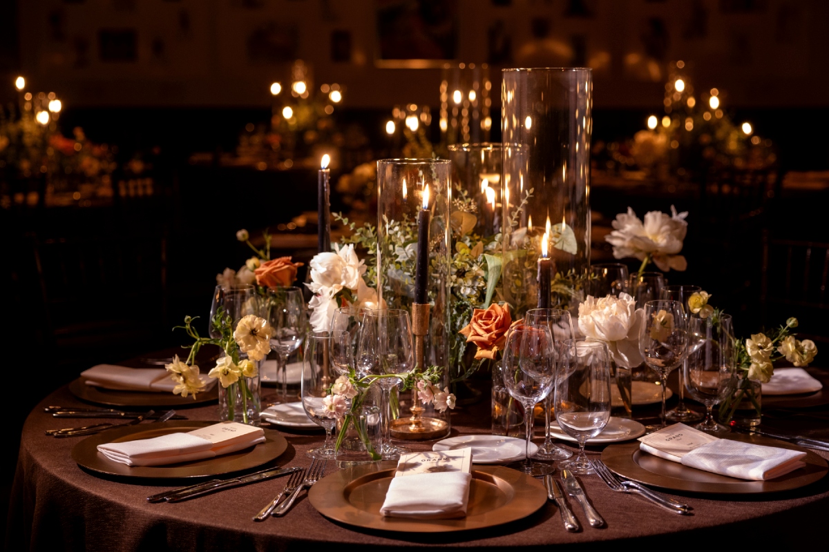 Elegant round dining table with brown linen at Soho Grand Hotel’s Gallery restaurant, set for an intimate New York City dinner.