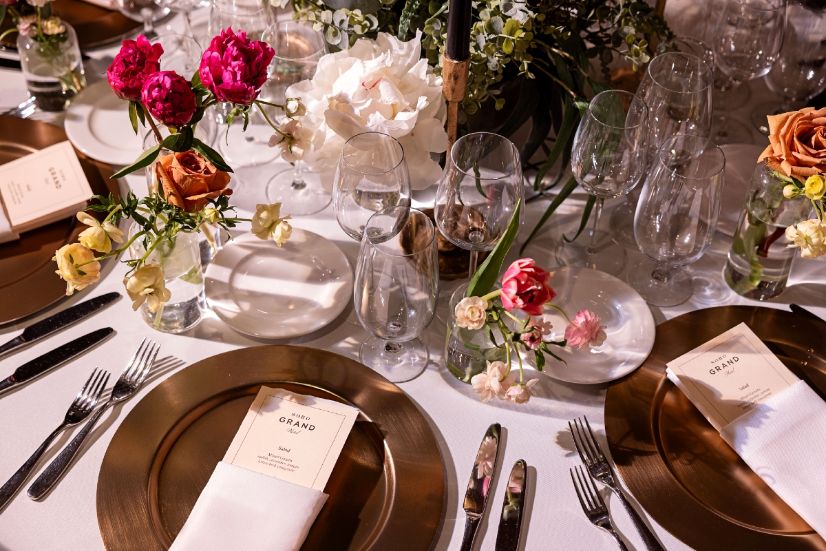 : Close-up of dinner plate and menu at Soho Grand Hotel’s Gallery restaurant, highlighting refined dining in downtown New York City.