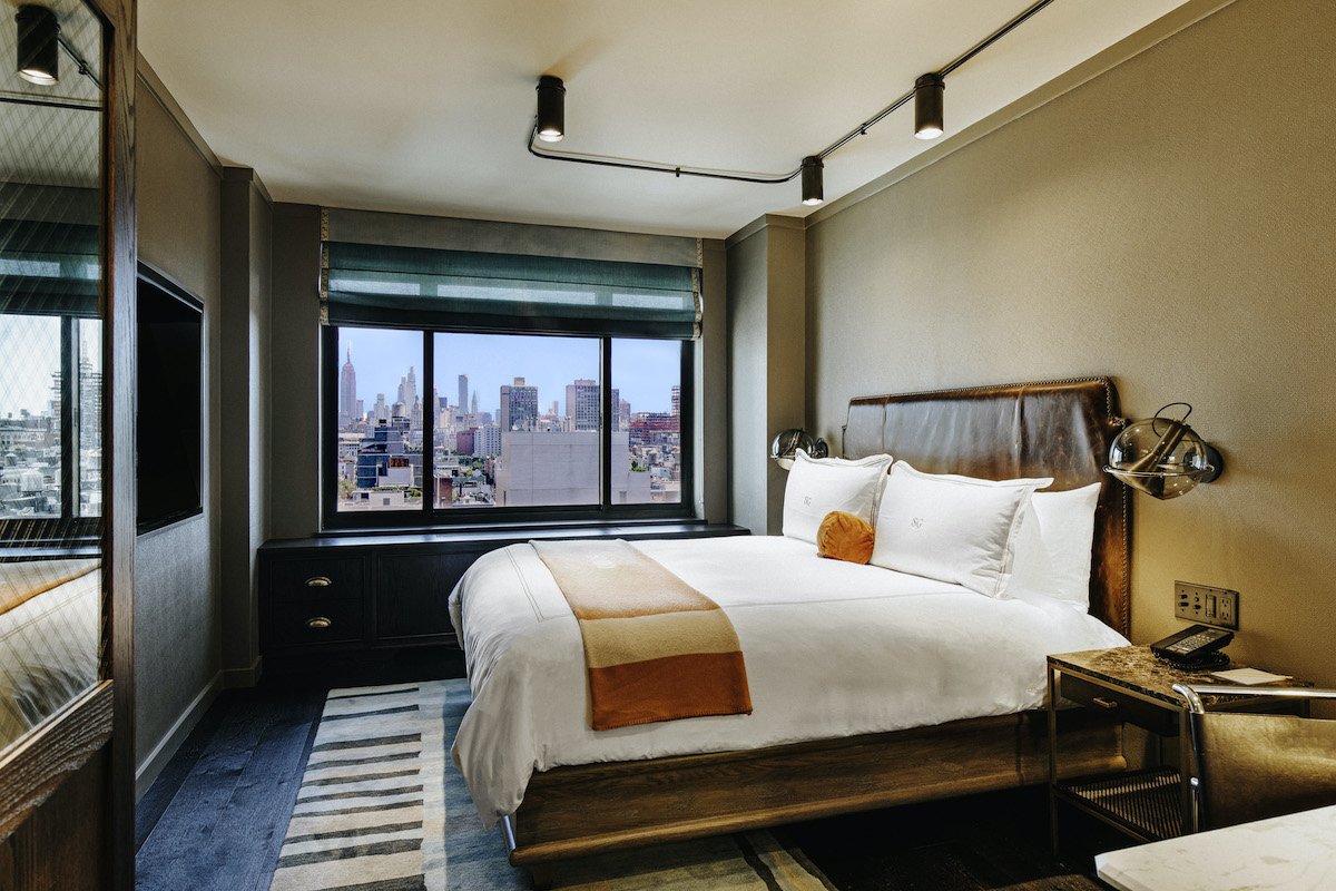 ADA Accessible bedroom with a king size bed and a view of the SoHo Neighborhood