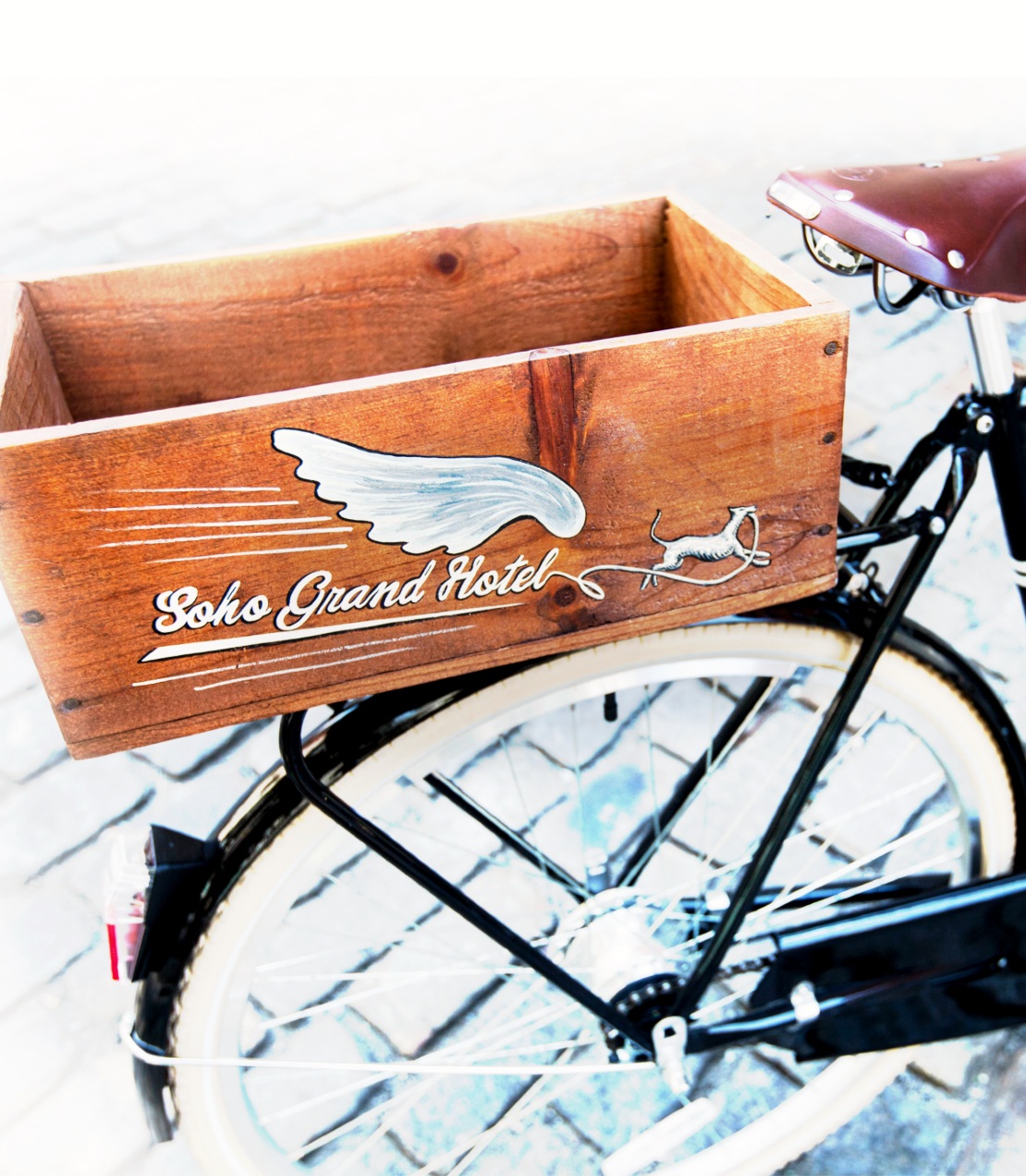 Bicycle with wooden cart on the back.