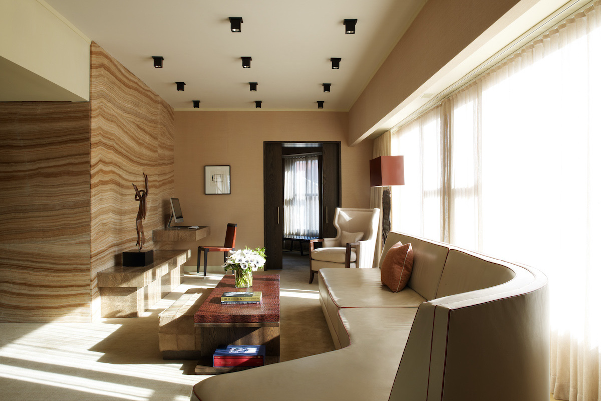 The Roxy Penthouse living room with a long beige modern couch and carefully curated design details