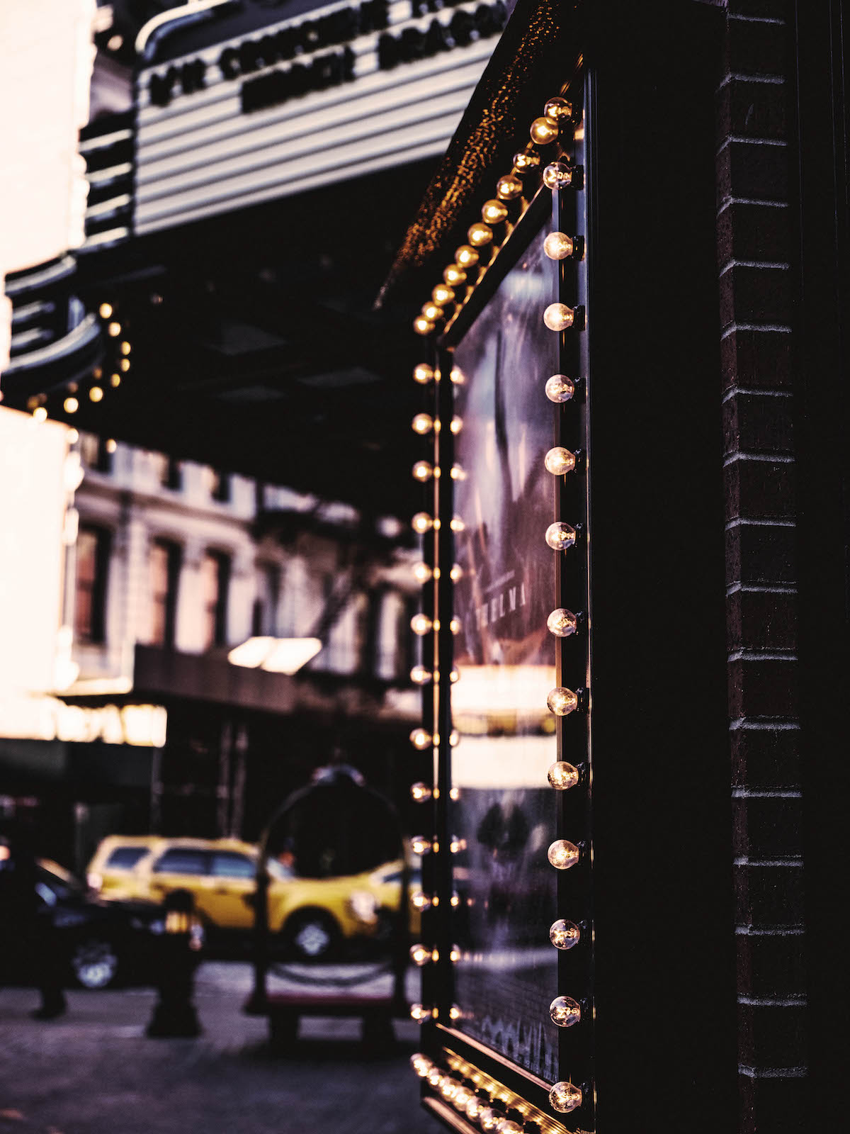 The Roxy Hotel marquee with globe lights lit around it