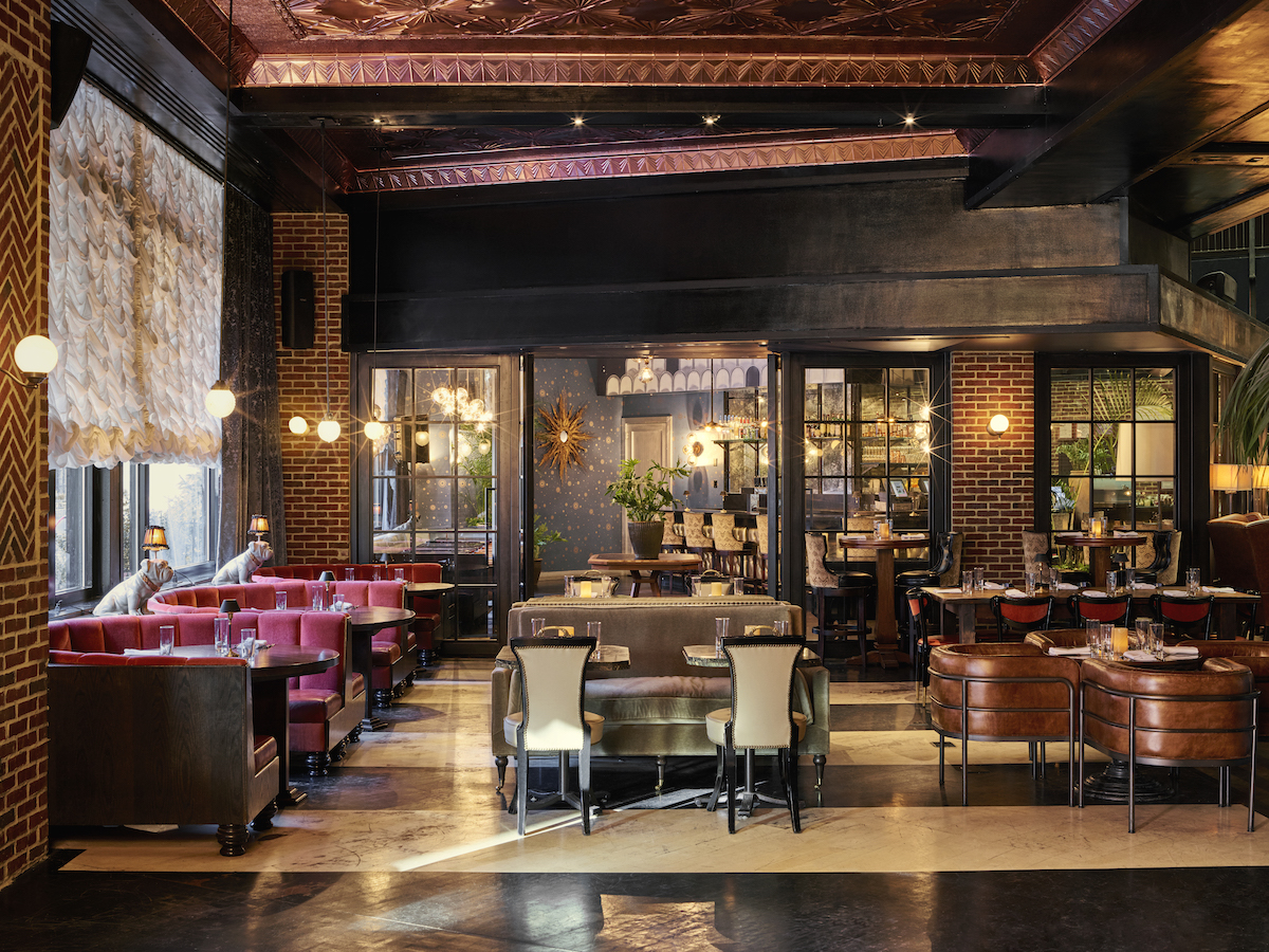 Roxy bar dining area with red velvet booths