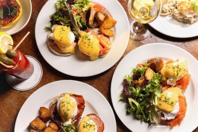 An assortment of Egg Benedict brunch entrees at Roxy Bar.