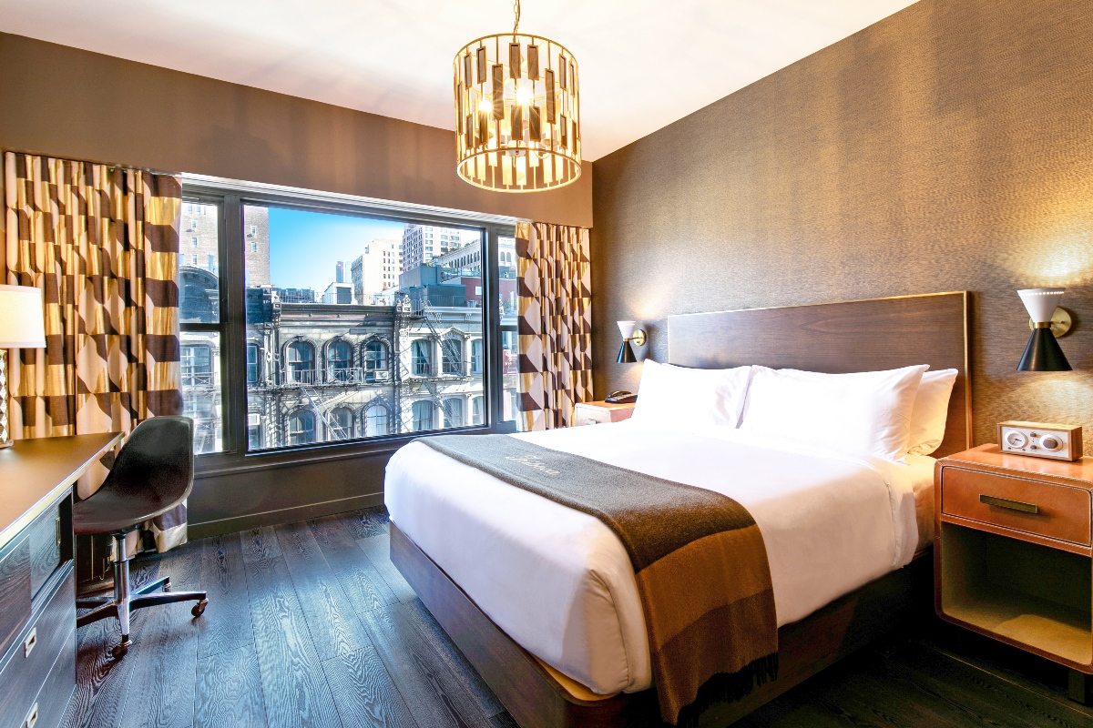 Roxy Deluxe King Room picture with bed, chandelier, and view of TriBeCa