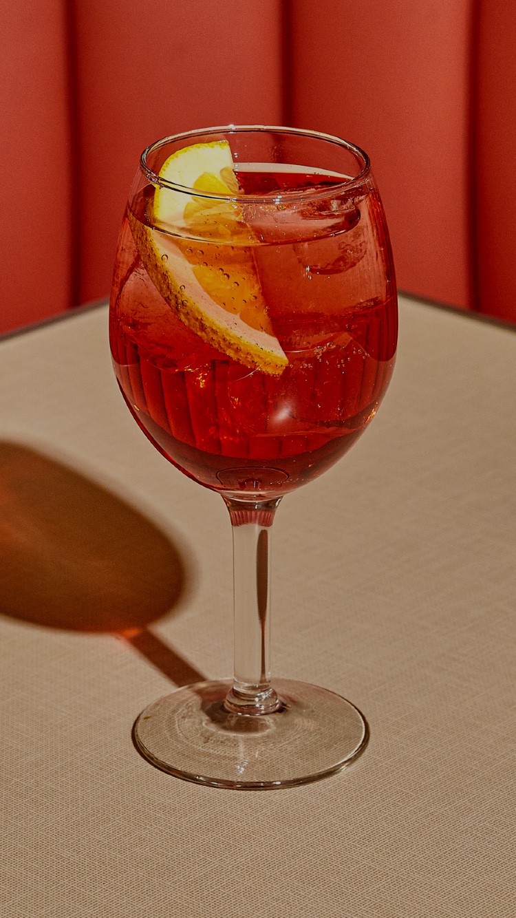 Aperol Spritz cocktail on a table at Soho Diner.