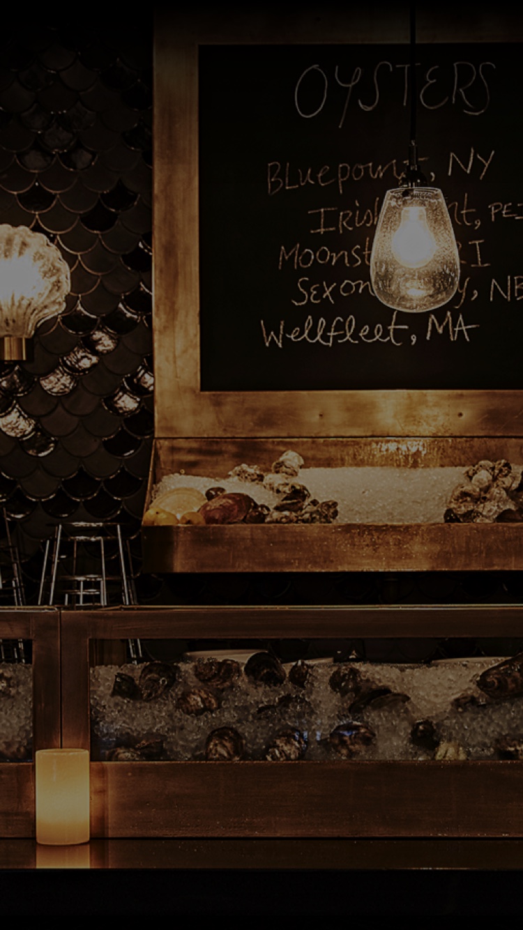 Oyster bar menu board and the oysters on ice at Roxy Bar.