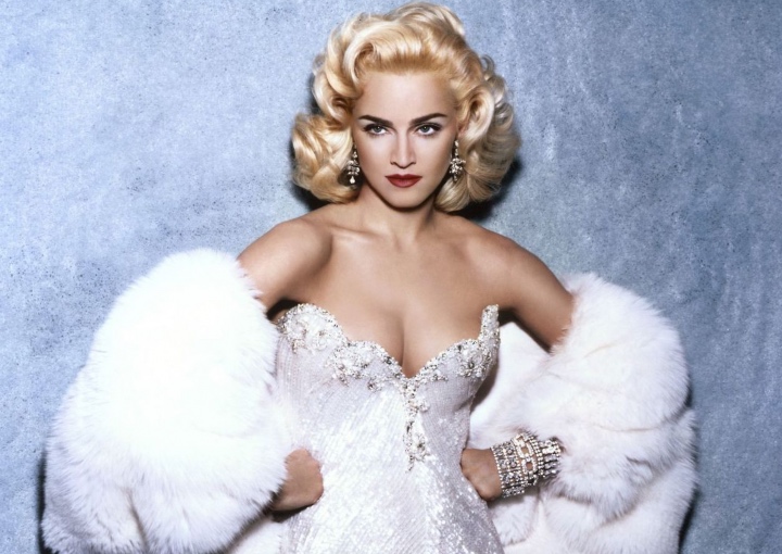 Madonna in a white gown and fur shawl from the early 1990's.
